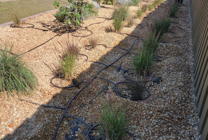 Custom drip irrigation installation helping plants survive summer heat in Fayetteville NC