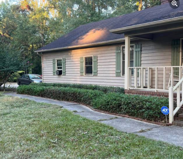 Overgrown bush and weed cleanup landscaping project in North Carolina